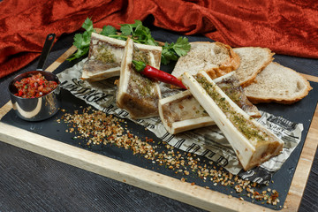 beef bone marrow with chimichurri sauce and french onion