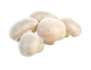 Raw champignon mushrooms on white background