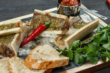 beef bone marrow with chimichurri sauce and french onion