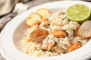 Plate with delicious seafood risotto, closeup