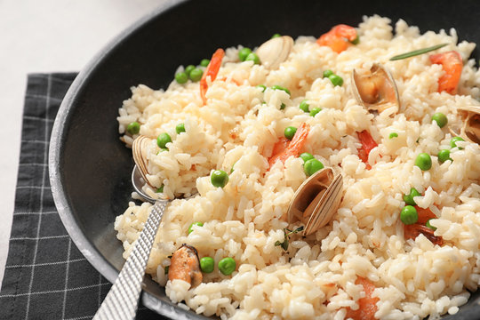 Dish with delicious seafood risotto, closeup
