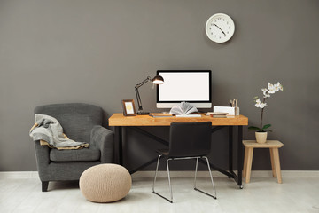 Comfortable home workplace with computer on desk