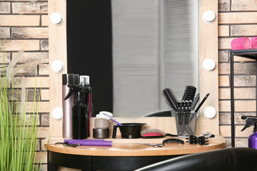 Professional hairdresser set on table in salon
