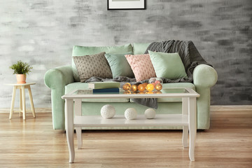 Comfortable mint sofa and table in living room