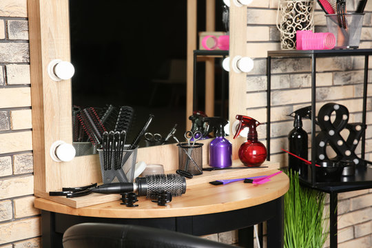 Professional hairdresser set on table in salon