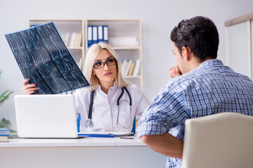 Doctor examining x-ray images of patient