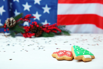 Christmas cookies on table against blurred American flag
