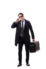 Young businessman with suitcase ready for business trip on white