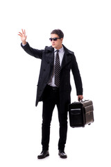 Young businessman with suitcase ready for business trip on white