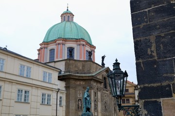 Fototapeta na wymiar Square of the Knights of the Cross. Krizovnicke namesti, at the end of Charles Bridge. Prague, Czech Republic.