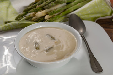 Seasonal fresh homemade asparagus soup made from white and green asparagus vegetables