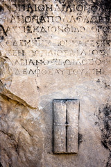 Ancient background, greek text letters carved in stone. Selcuk / Turkey