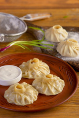 Uzbek manti with sour cream