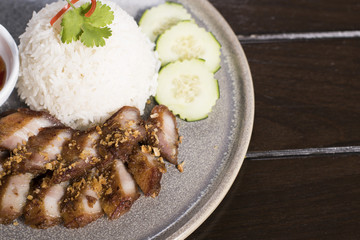 Deep Fried Pork Belly over Rice  served with spicy sauce
