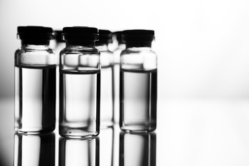 Group of ampoules with a transparent medicine in medical laboratory