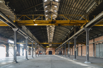 Old and dusty warehouse, with light coming through openings