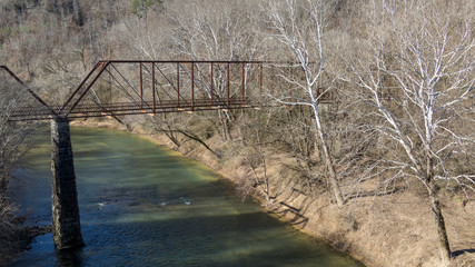 Old abandoned iron bridge over locust fork river in warrior alabama