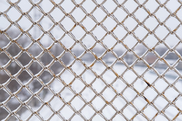 Fototapeta premium metal mesh winter frozen in ice abstract background
