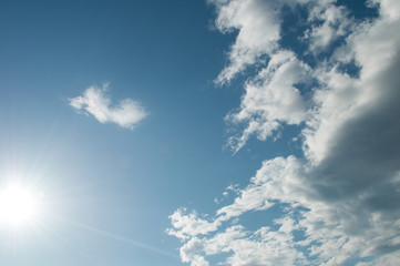 Naklejka na ściany i meble Blue sky in full day with white clouds, blue sky and sunbeams