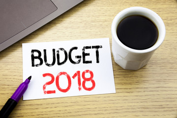 Handwriting Announcement text showing Budget 2018. Business concept for Household budgeting accounting planning written on notebook book on the wooden background in the Office with laptop coffee