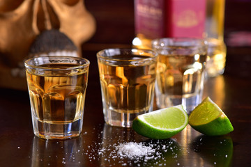 Tequila shoots on dark background