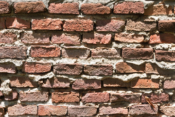 background of uneven old bricks with shadows