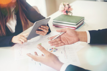 Startup business people group meeting. People group sitting on conference together and making notes. hands pointing at business document during discussion at meeting.