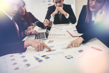Startup business people group meeting. People group sitting on conference together and making notes. hands pointing at business document during discussion at meeting.