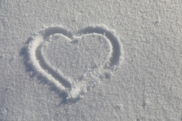 Love symbol on snow