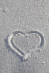 Heart symbol on snow background