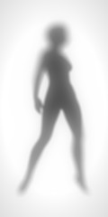 Sexy women silhouette. Fashion mannequin. Female figure posing. Diffuse silhouette of a slim lady behind a glass surface