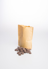 chocolate pile with paper bag on a background.
