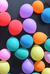 Colorful balloons with celebration and various party confetti.