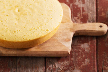 sponge cake on old wooden table.