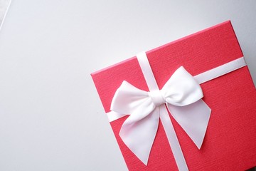  Valentine present. Gift box and red ribbon for romantic couple.