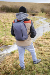 Tourism. Traveler with a backpack . Hiking in the spring