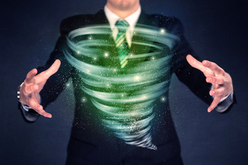 Businessman holding green tornado
