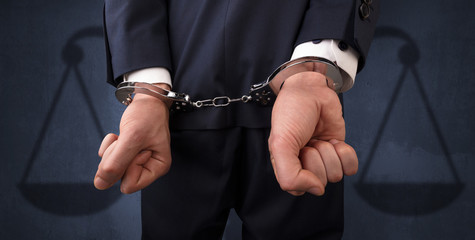 Arrested man with balance on the background