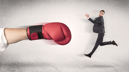 Businessman gets fired by a huge boxing hand