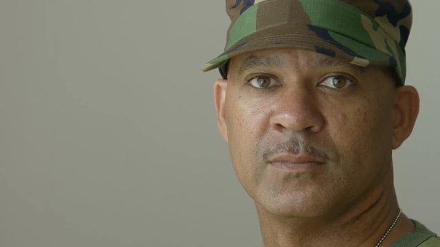 Portrait of an African American man wearing military fatigues