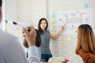 Female college student making a presentation in classroom