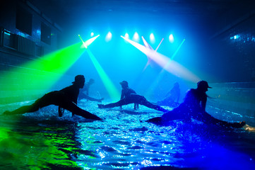 Girls dancing on the water with beautiful light.