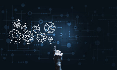 Glowing cogwheel mechanism icon on dark background as symbol of teamwork