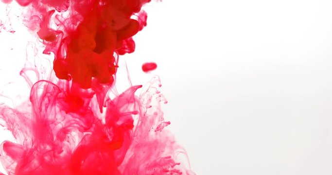 Close up red colored drop in the water , abstract motion movement of watercolor ink splashing background , 4K Dci resolution