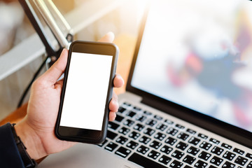 business woman sits in airplane watching his cell phone.