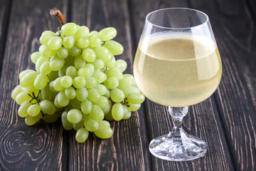 fresh green grapes and wineglass
