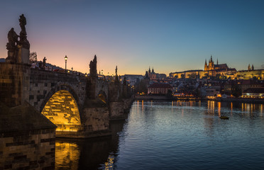 It's evening in the city of Prague. View of the castle and the Charles bridge. Czech Republic.