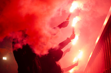 football fans lit up the lights and smoke bombs. revolution. protest