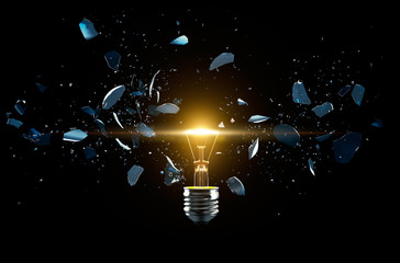 Broken light bulb on a black background