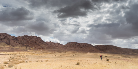 Trekking in Negev dramatic stone desert, Israel